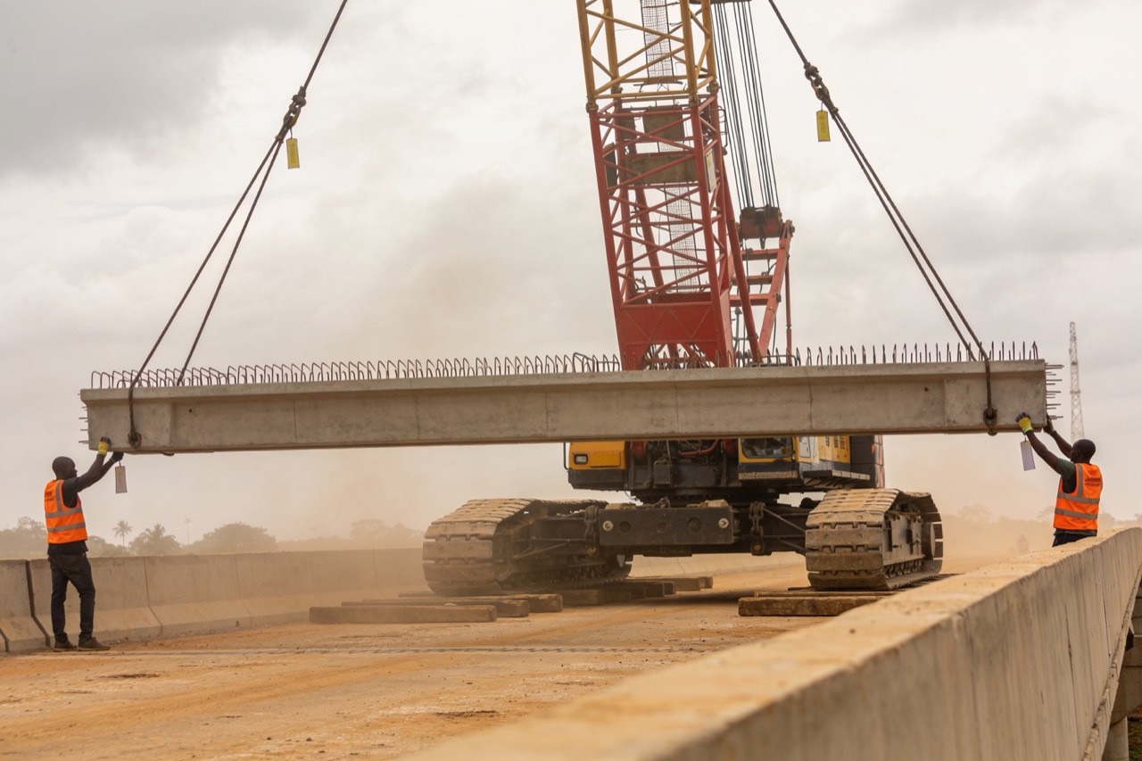 Bridge & Structural Engineering — Lifting a precast girder into place