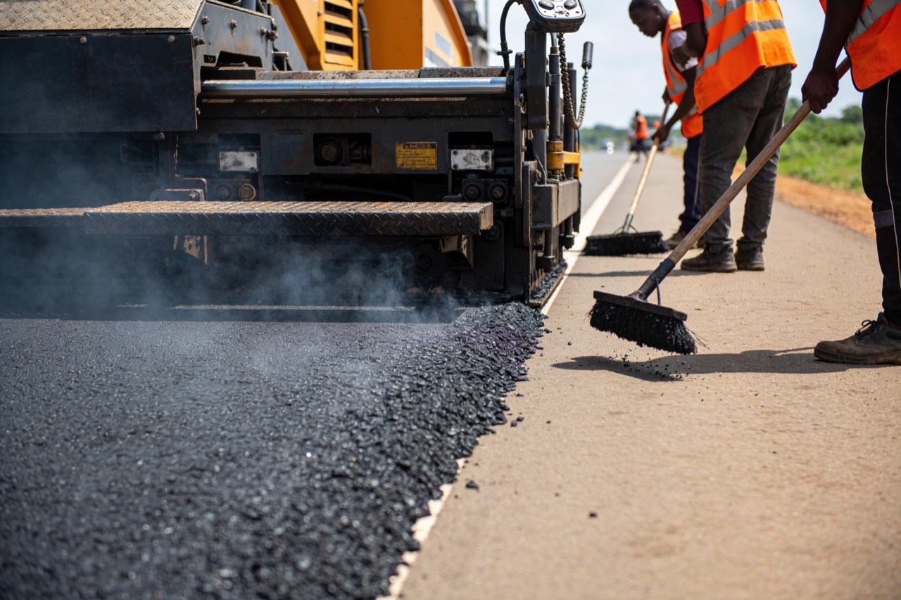 Highway Engineering & Transportation Planning — Paver laying hot asphalt