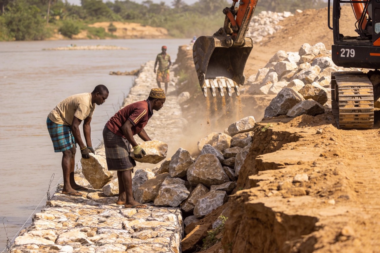 Erosion & Flood Control — Placing rock riprap armour